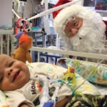 Motorcycle Santa brings Christmas in July