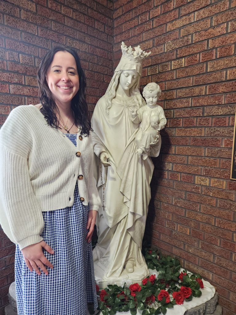 Kara with the Blessed Mother statue in the entrance to the Marian Center for Peace in
Wisconsin Rapids for adoration.